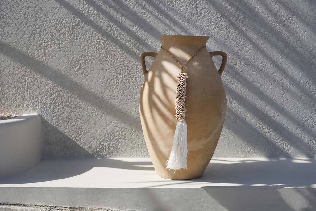 La borla de caurí y algodón - natural